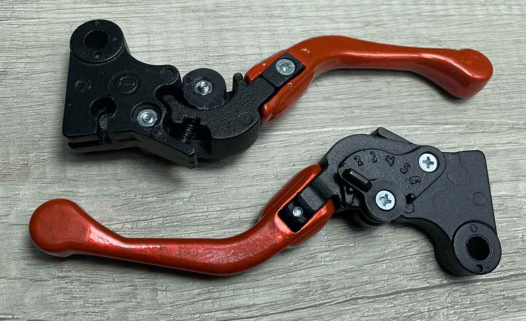 MANETE MINI ESPORT REG DOBRAVEL CG125/CG150 LARANJA NEON PAR (FREIO LONA)